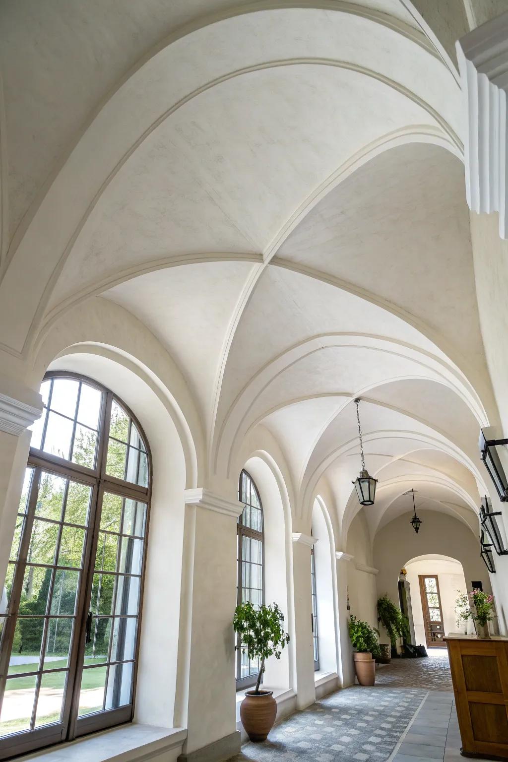 Crisp white barrel-vault ceiling—quiet, timeless curves that make any room feel taller.