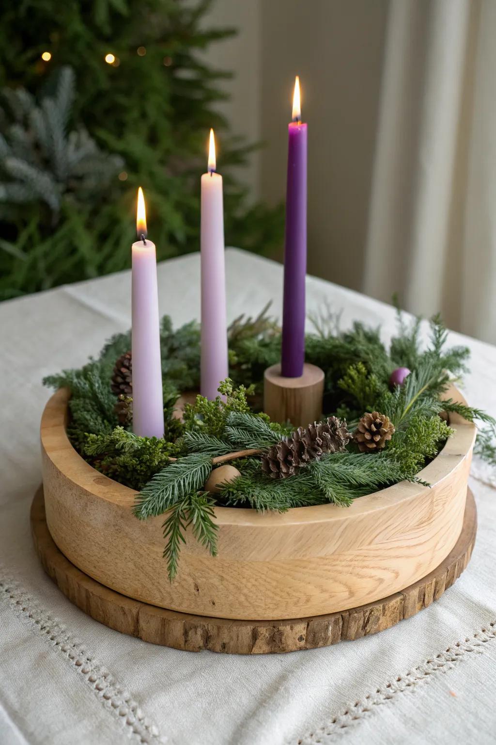 Classic Advent wreath on a handcrafted oak base—fresh greens with 3 violet + 1 rose candle.