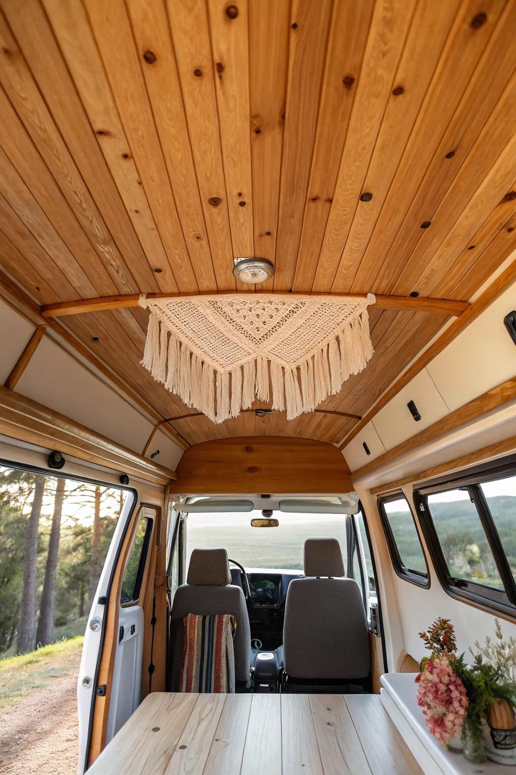 Honey-toned tongue-and-groove ceiling boards turn a van into a tiny lodge at golden hour.