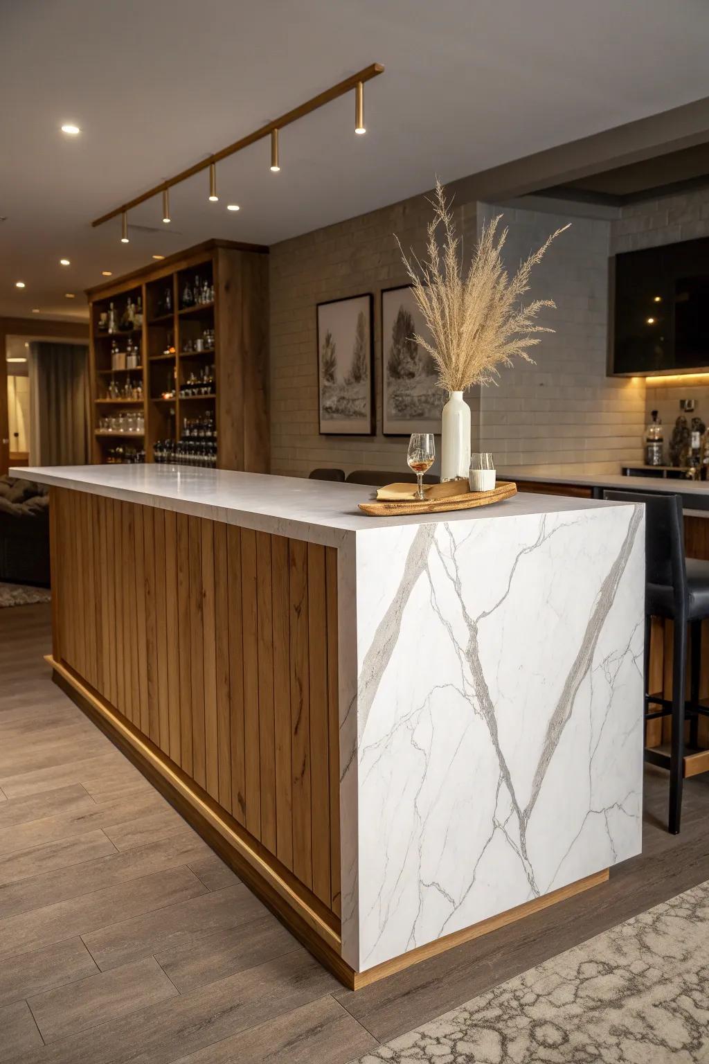Stone waterfall countertop + warm oak base—hotel-lounge luxury for a basement bar.