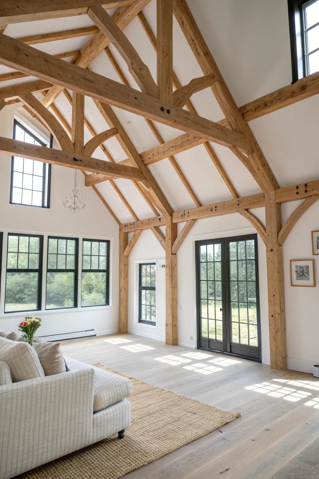 Open-concept great room with handcrafted exposed beams—small barn home, big airy volume.