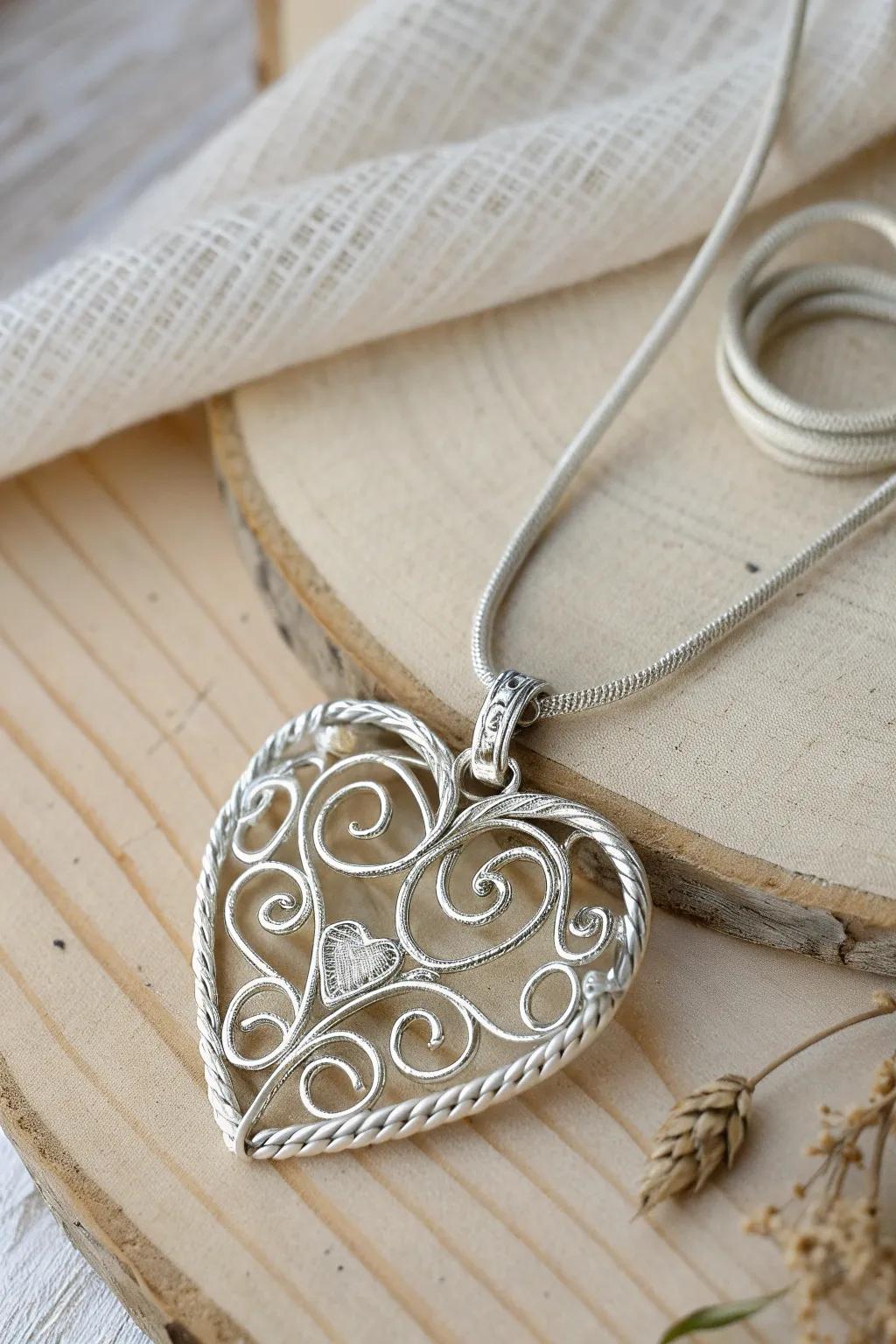 Discover the elegance of intricate wire wrapping: A minimalist heart pendant that speaks volumes.