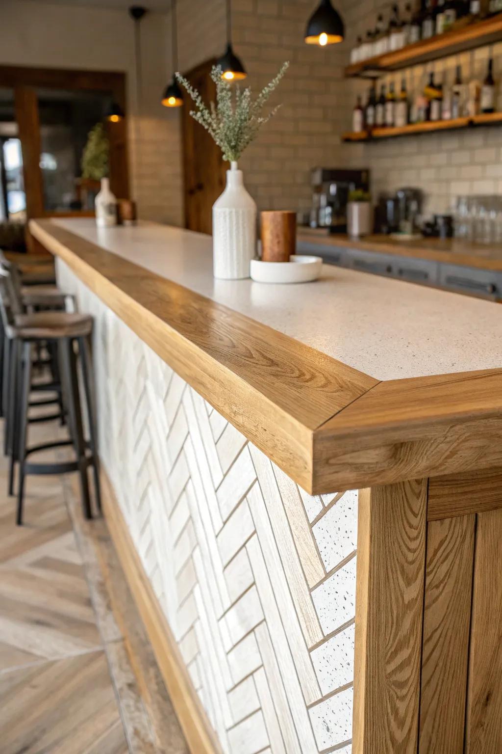 Tile-inset oak bar top: warm wood frame, matte patterned tiles, and cozy pendant-light contrast.