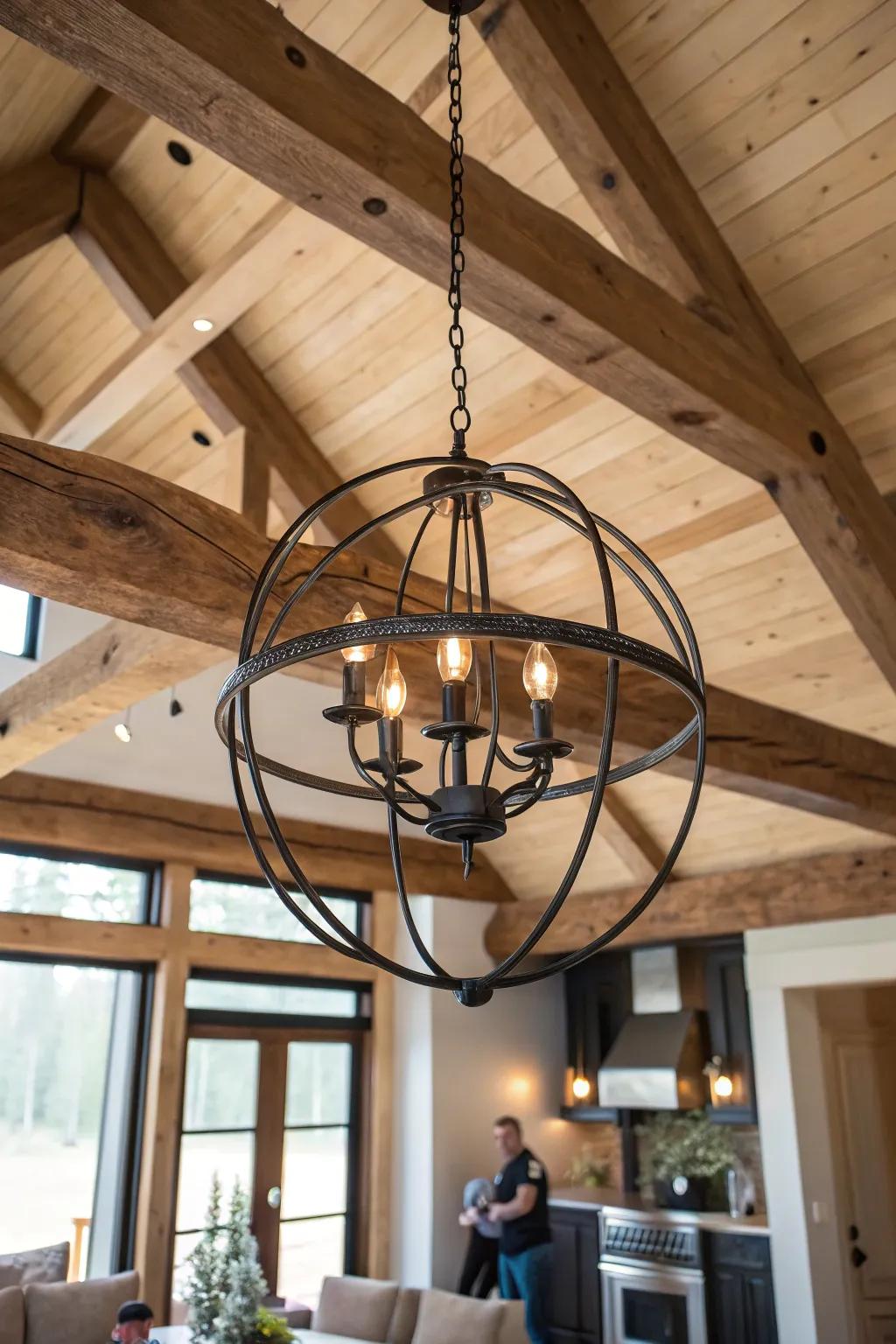 Rustic beams meet a modern orb chandelier—muted metal + warm bulbs for cozy cabin contrast.