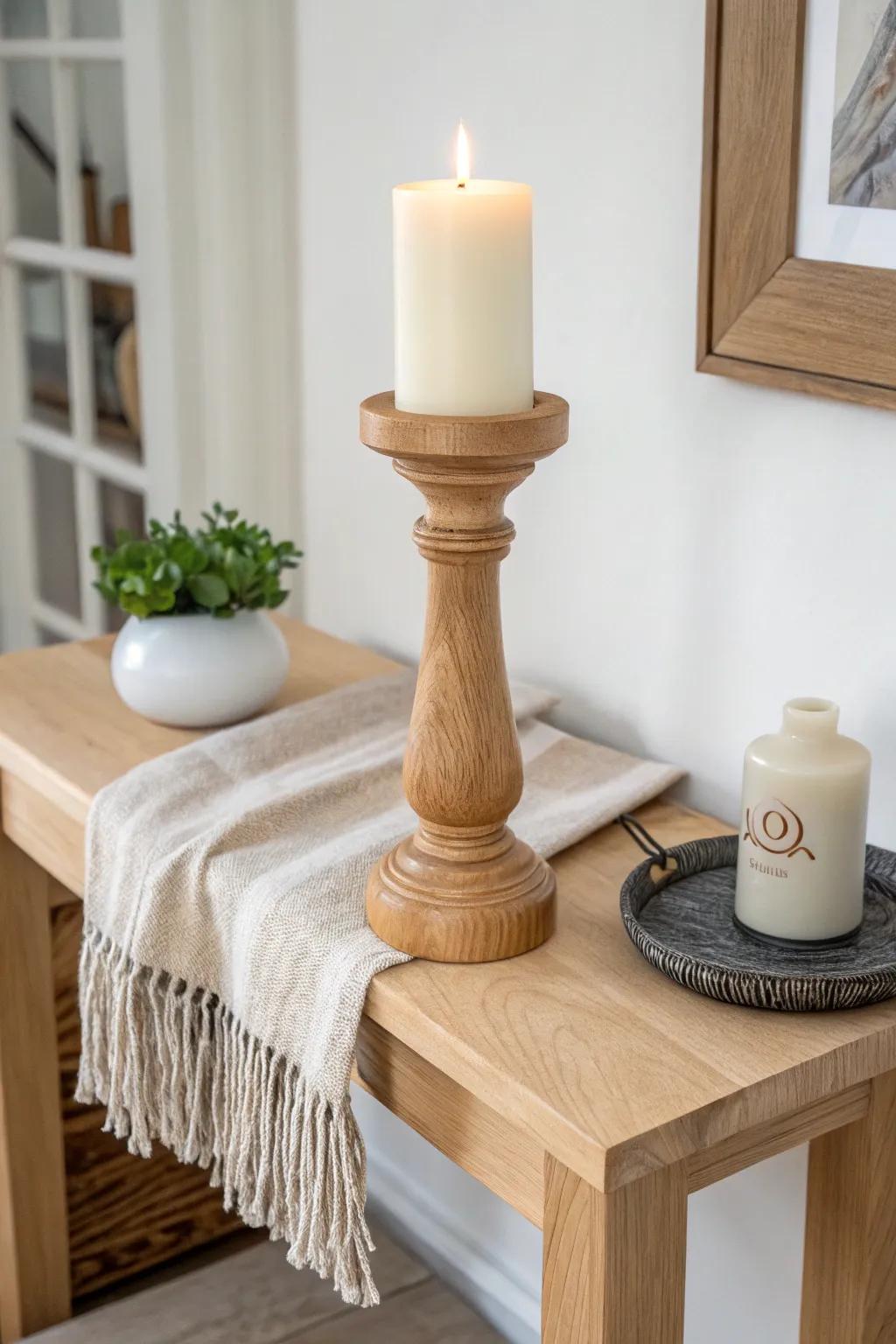 A single sculpted wooden candleholder adds cozy winter glow to a minimalist console.