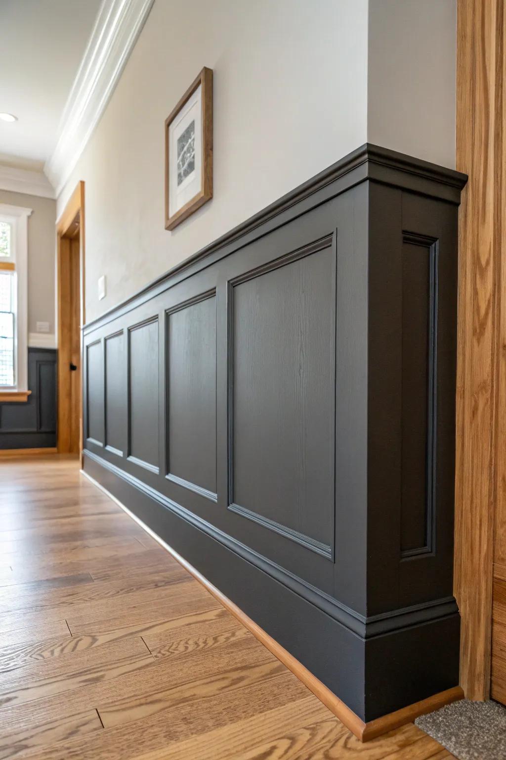 Two-tone wainscoting that grounds a tall foyer—dark panels below, airy walls above.