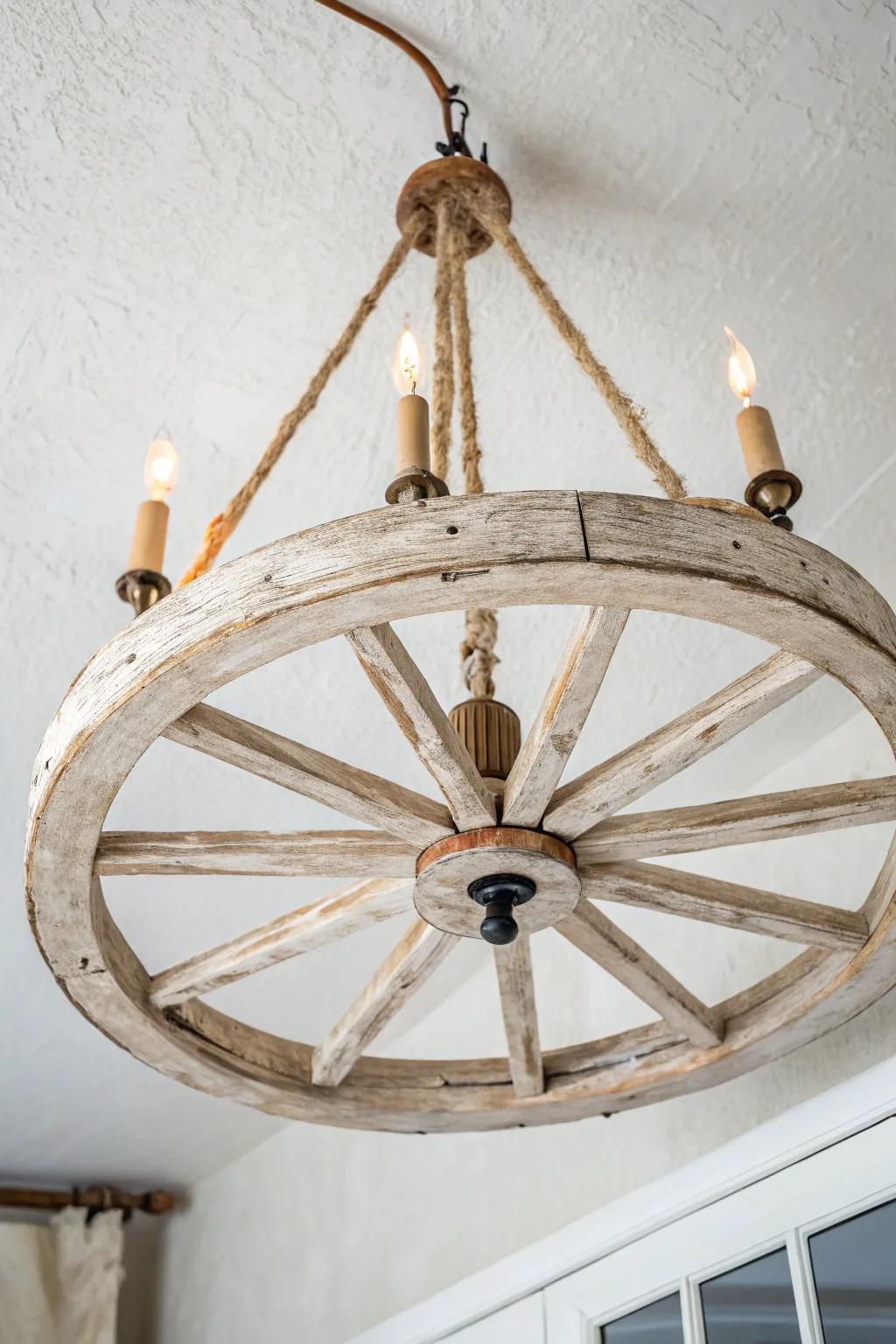 Whitewashed wagon wheel light—airy farmhouse glow with visible grain and softly worn edges.