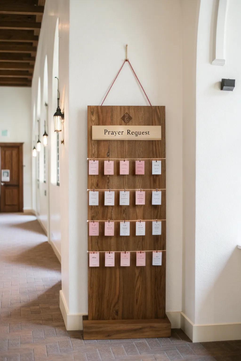 A warm wood prayer request wall with pegs and “We’re Praying With You” header.