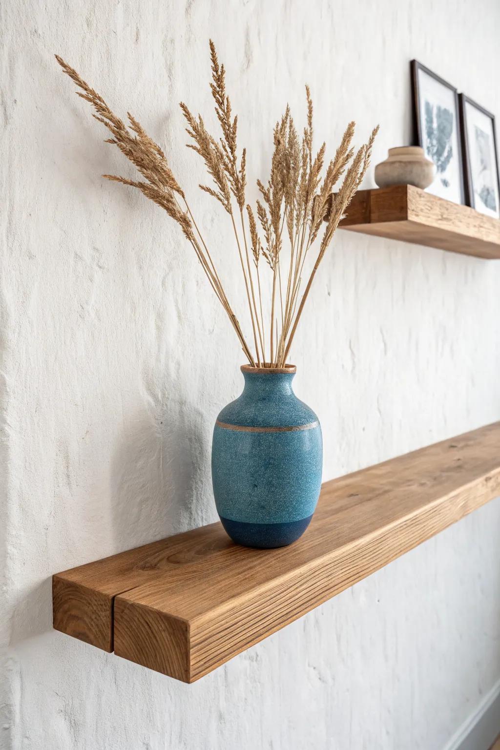 One oak floating shelf, one statement vase—minimal styling that keeps the living room calm.