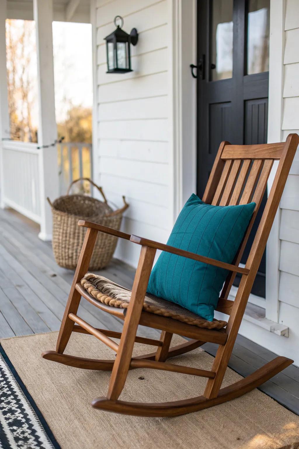 Porch rocker refresh: bold pillow + striped rug and natural textures for cozy charm.