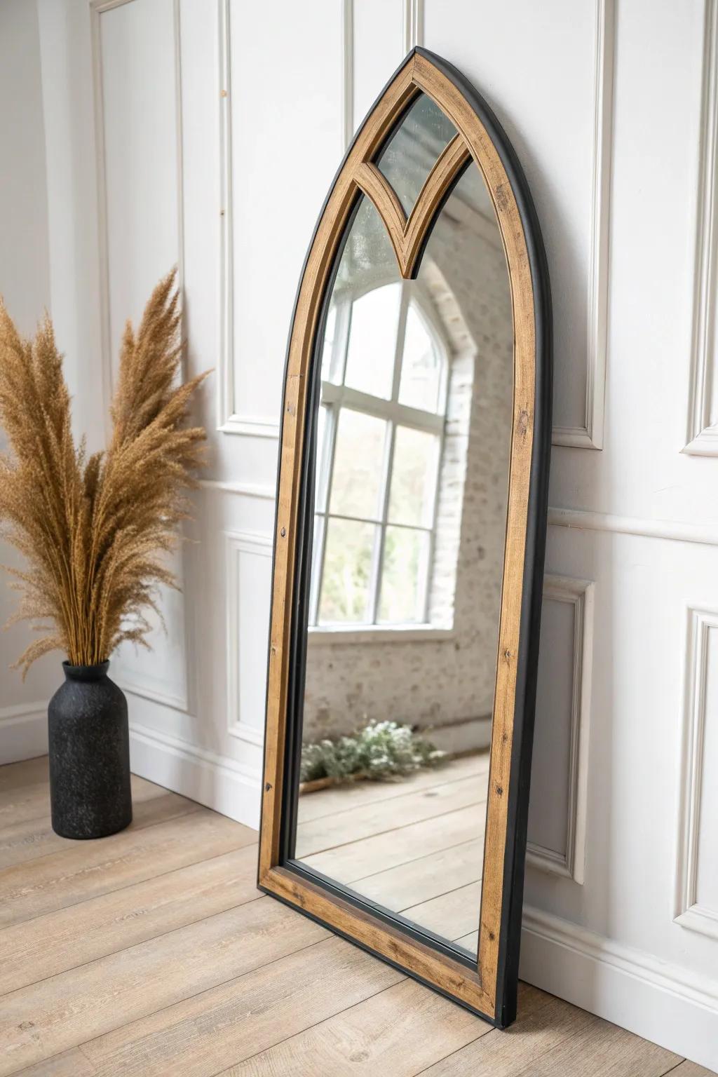 Charcoal-distressed Gothic arch mirror—minimalist, handcrafted drama with medieval flair.