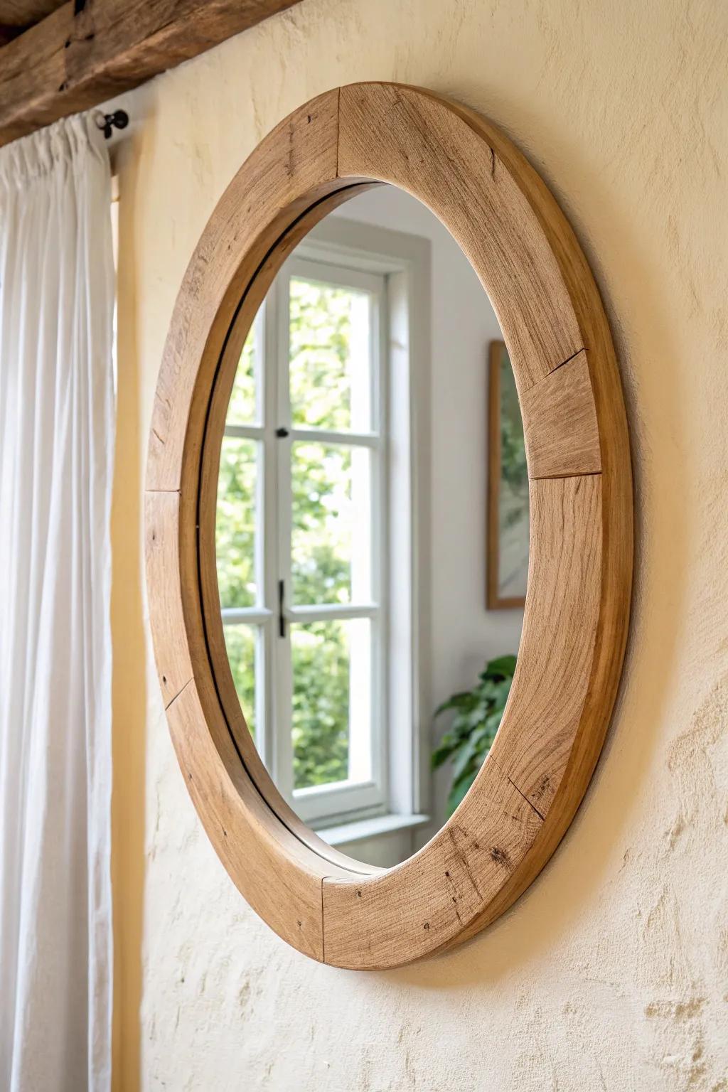Round oak mirror with natural texture—airy light, clean lines, and modern boho warmth.