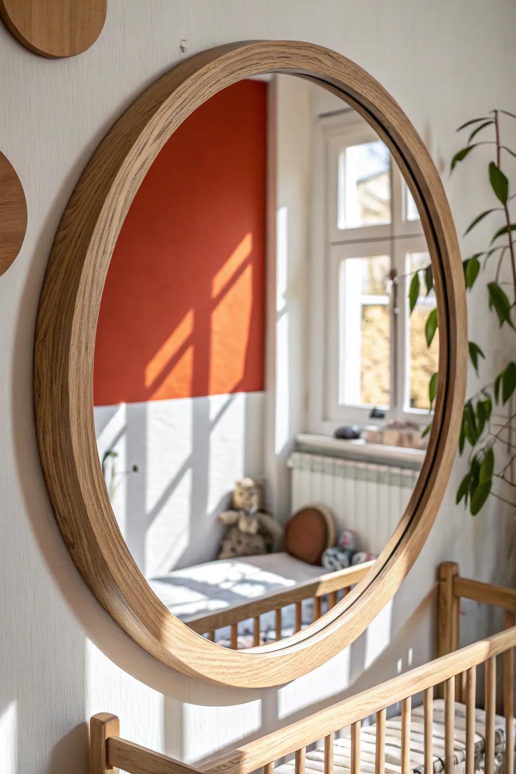 A handcrafted round mirror echoes the crib’s curves, making the nursery feel brighter and bigger.