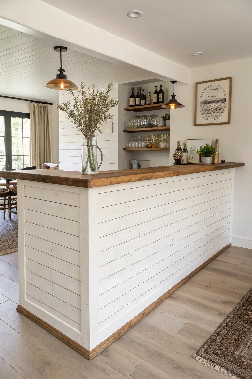A half-wall shiplap bar divider that defines a serve-here zone while keeping the space open.
