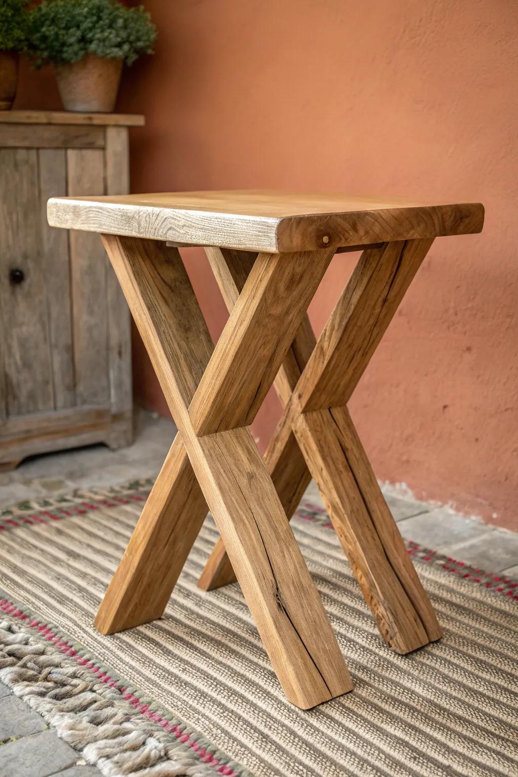 Minimal X-frame stool in wide oak planks—rustic strength with clean Scandinavian contrast.