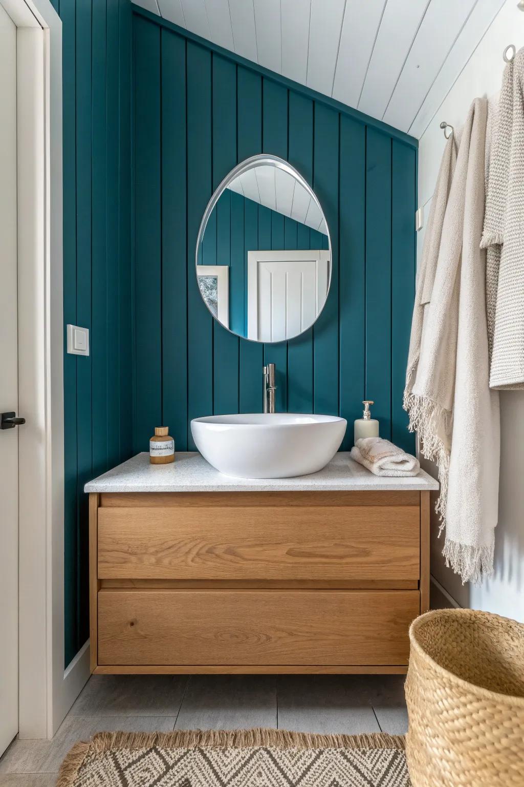 Vertical shiplap in rich teal makes this tiny powder room feel taller—simple, bold, calm.