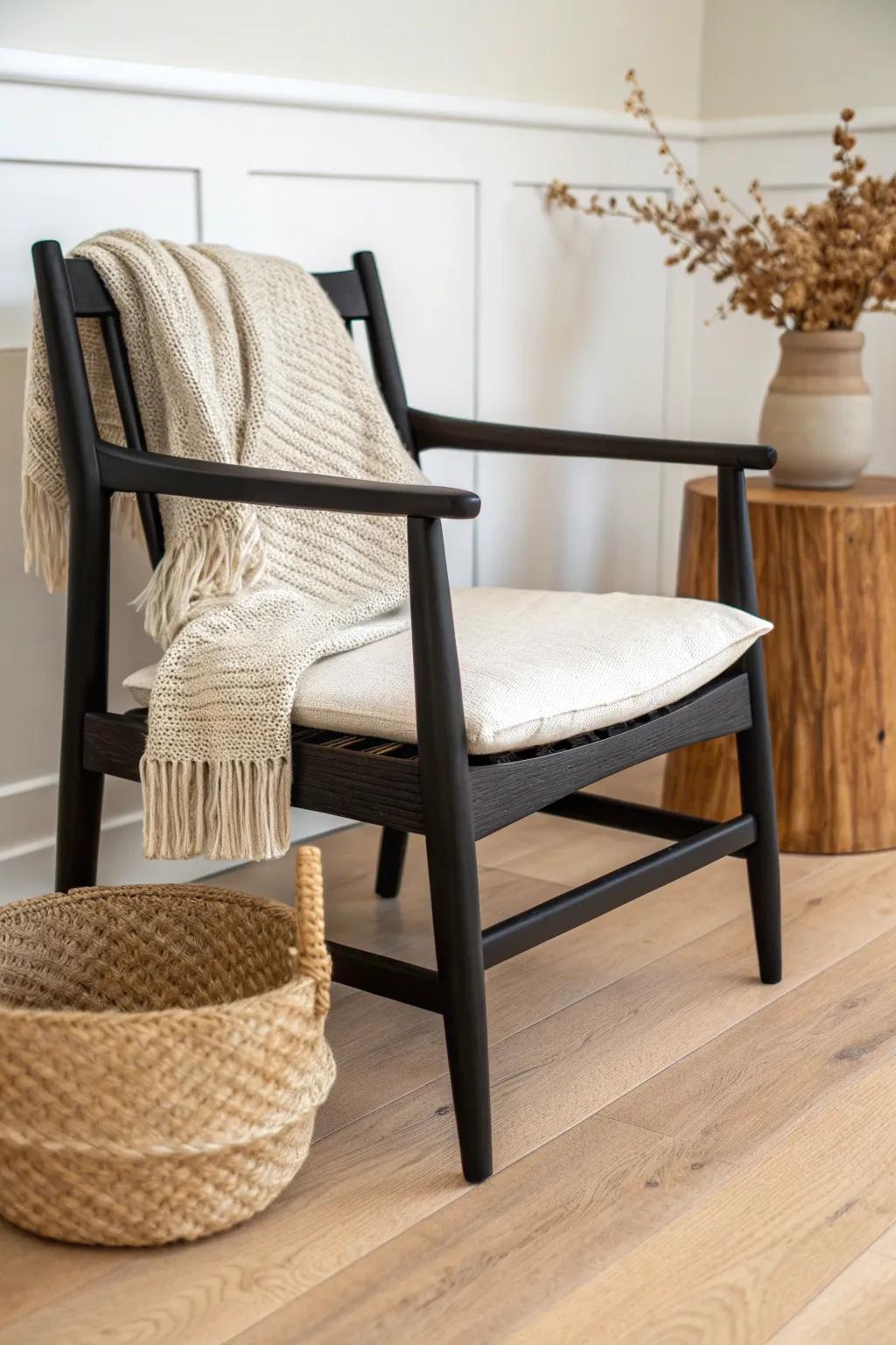 Make black furniture feel cozy—pair matte black wood with chunky knits, linen, and woven texture.