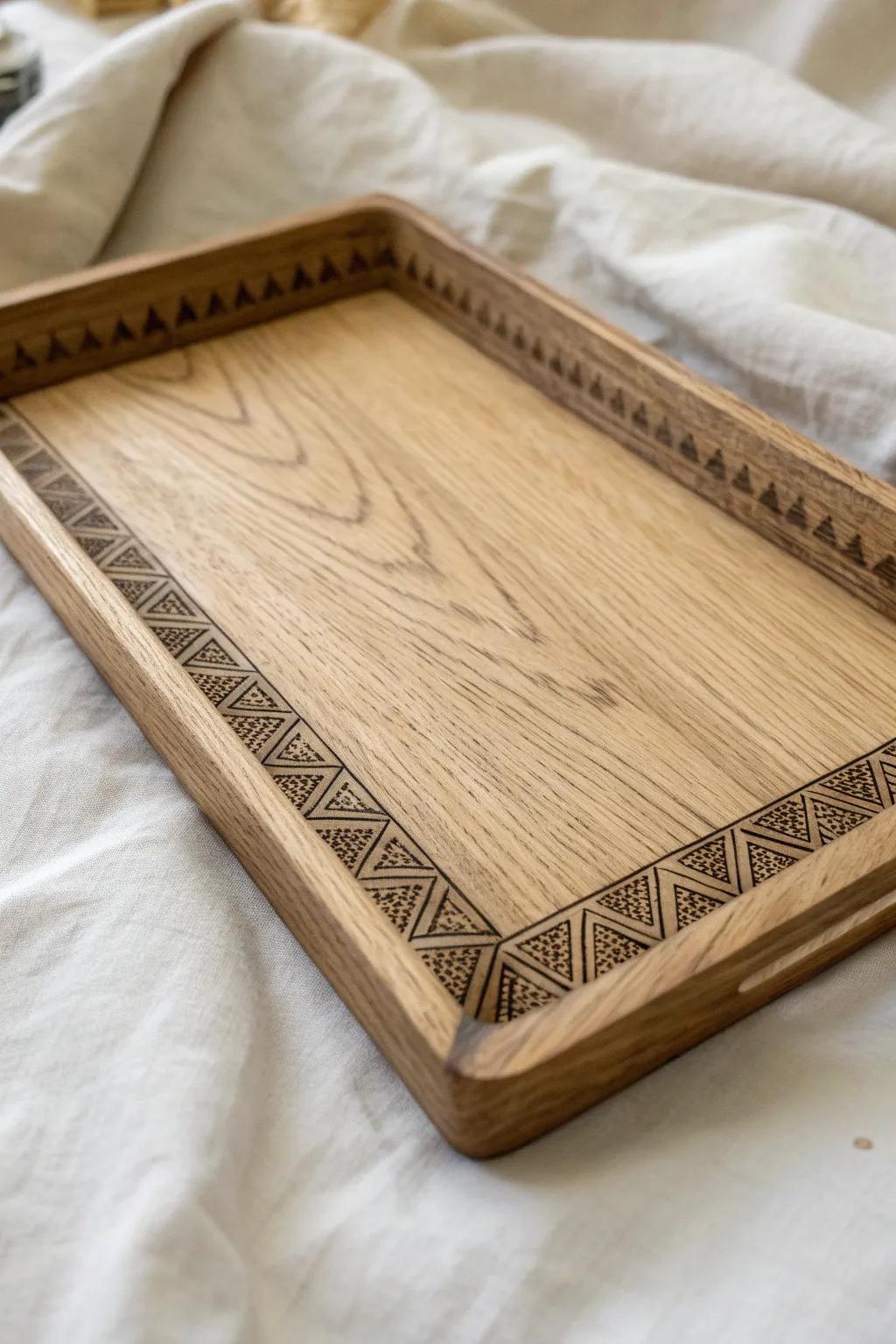 Minimal oak tray with a hand-burned border—simple, warm, and striking coffee-table decor.