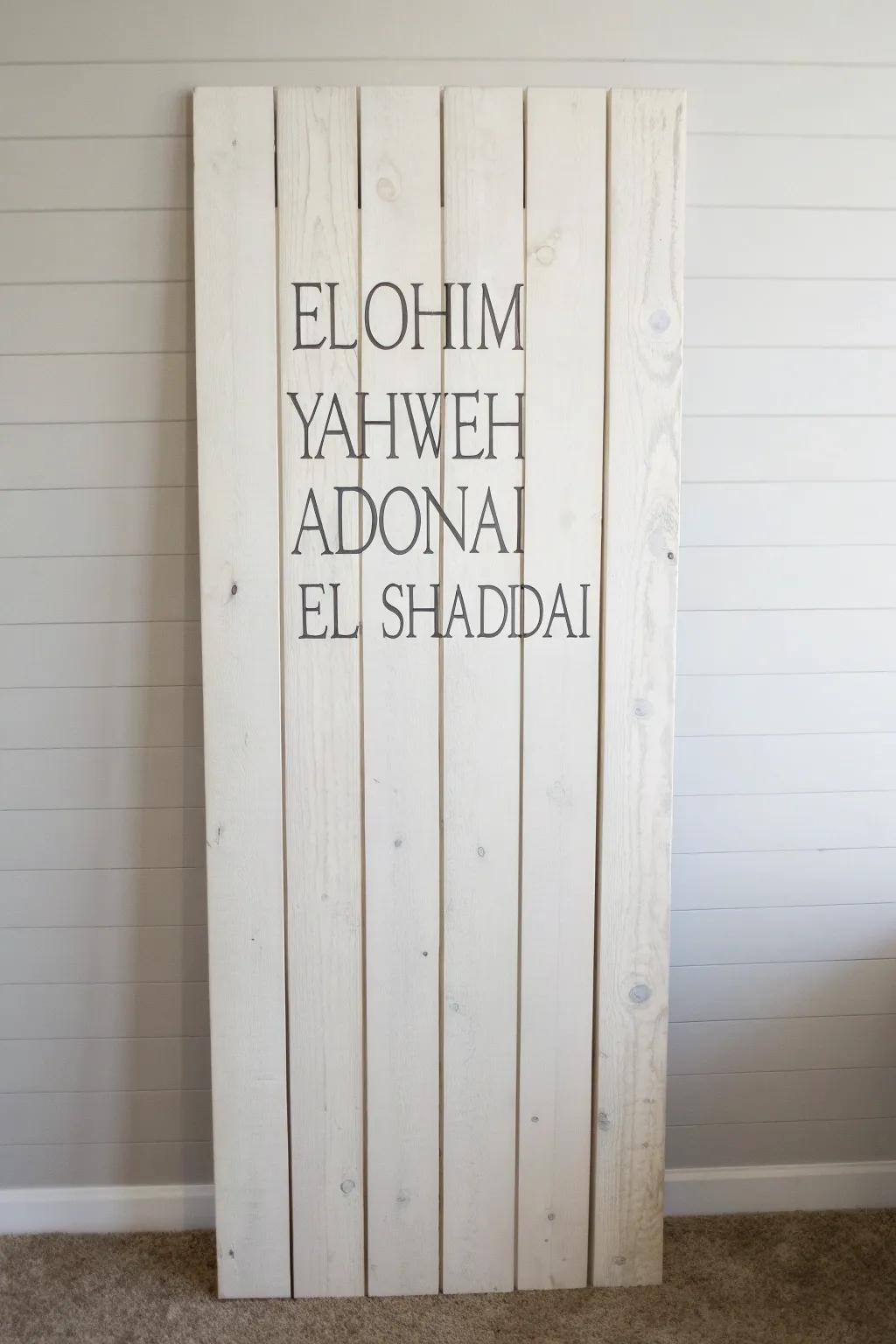Hand-lettered Names of God on painted wood slats—minimal, boho-soft, and deeply calming.