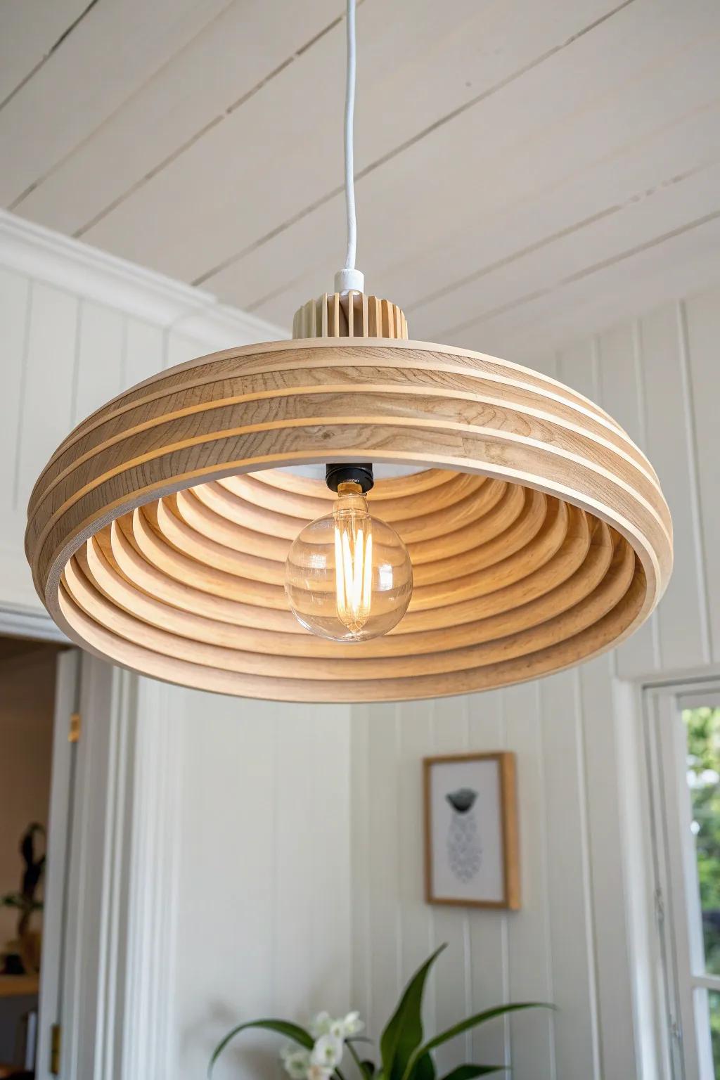 Layered plywood rings create a soft, modern pendant glow—minimal, warm, and handcrafted.