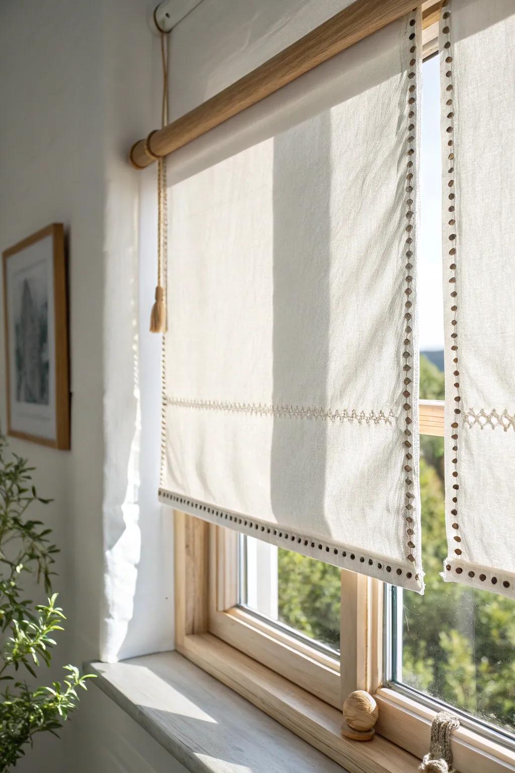 A sailcloth-inspired woven shade adds breezy coastal softness to a light oak kitchen window.