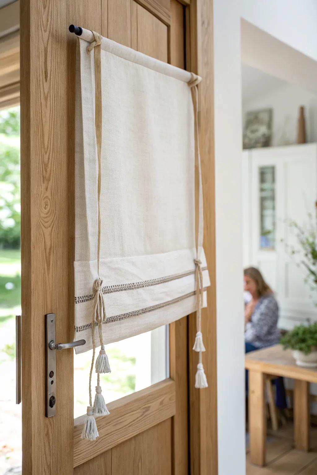 Sweet tie-up linen shade with a wood dowel—soft, adjustable light control for any door.