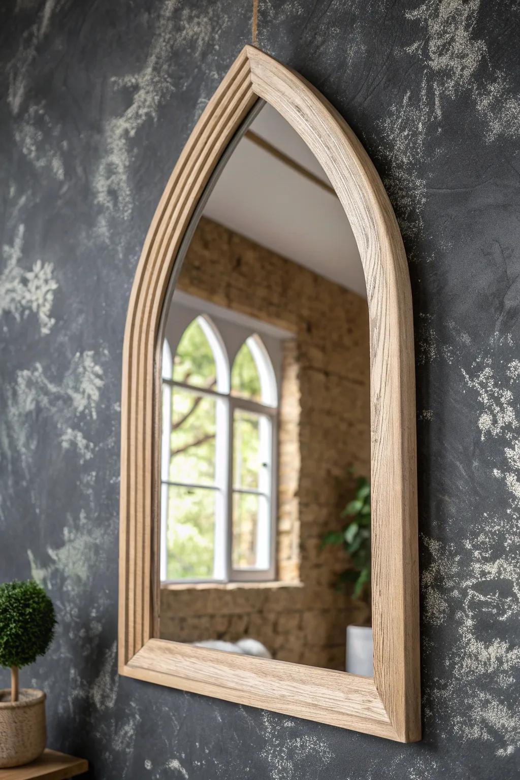 Hand-carved oak arch mirror glowing against smoky limewashed walls—minimal medieval drama.