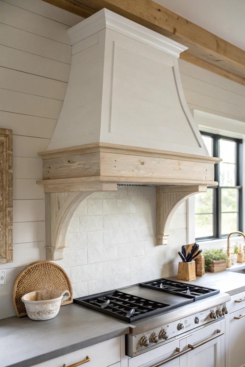 A bold white wood range hood brings balance and custom charm to a white kitchen with a black island.