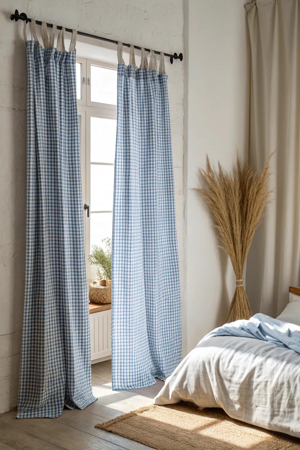 Blue gingham curtains hung high for an instantly taller, brighter farmhouse bedroom look.