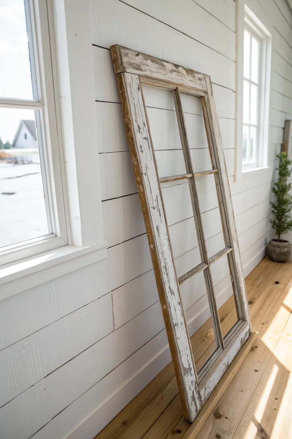 Budget farmhouse charm: a salvaged window sash wall piece with perfectly chippy paint.