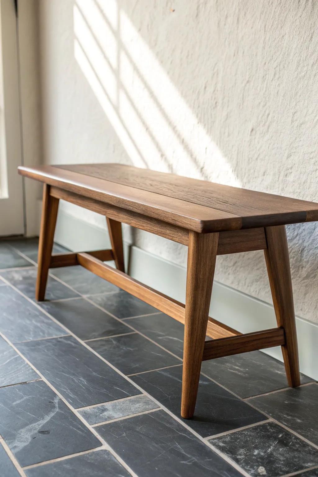 Smoky slate meets warm walnut—moody MCM entry flooring that’s tough on wet shoes.