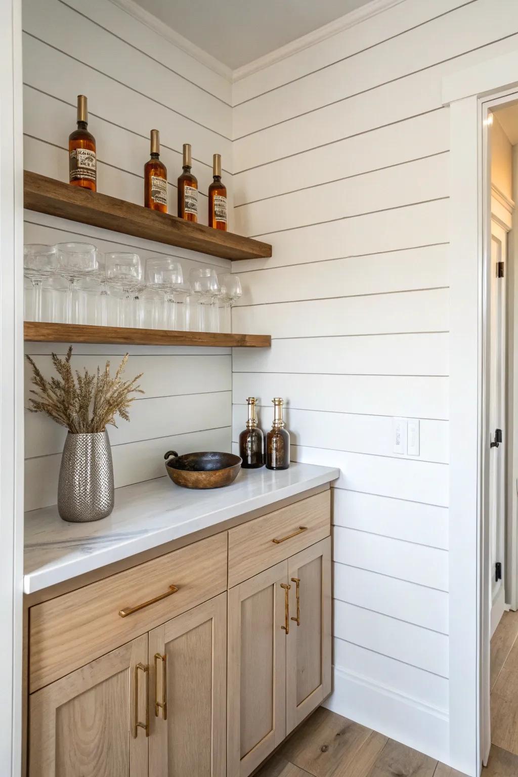 Shiplap-backed mini bar nook—simple boards, warm oak shelves, and a cozy farmhouse glow.
