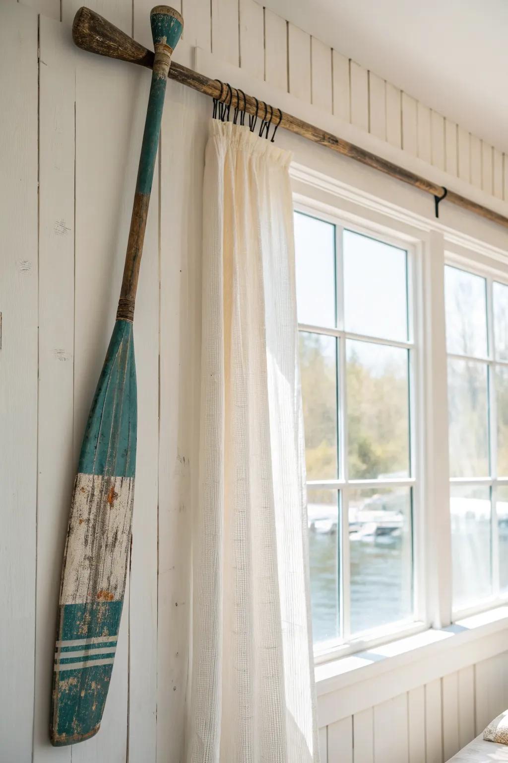 Vintage wooden oar curtain rod—sunlit, weathered paint and grain for effortless boho charm.