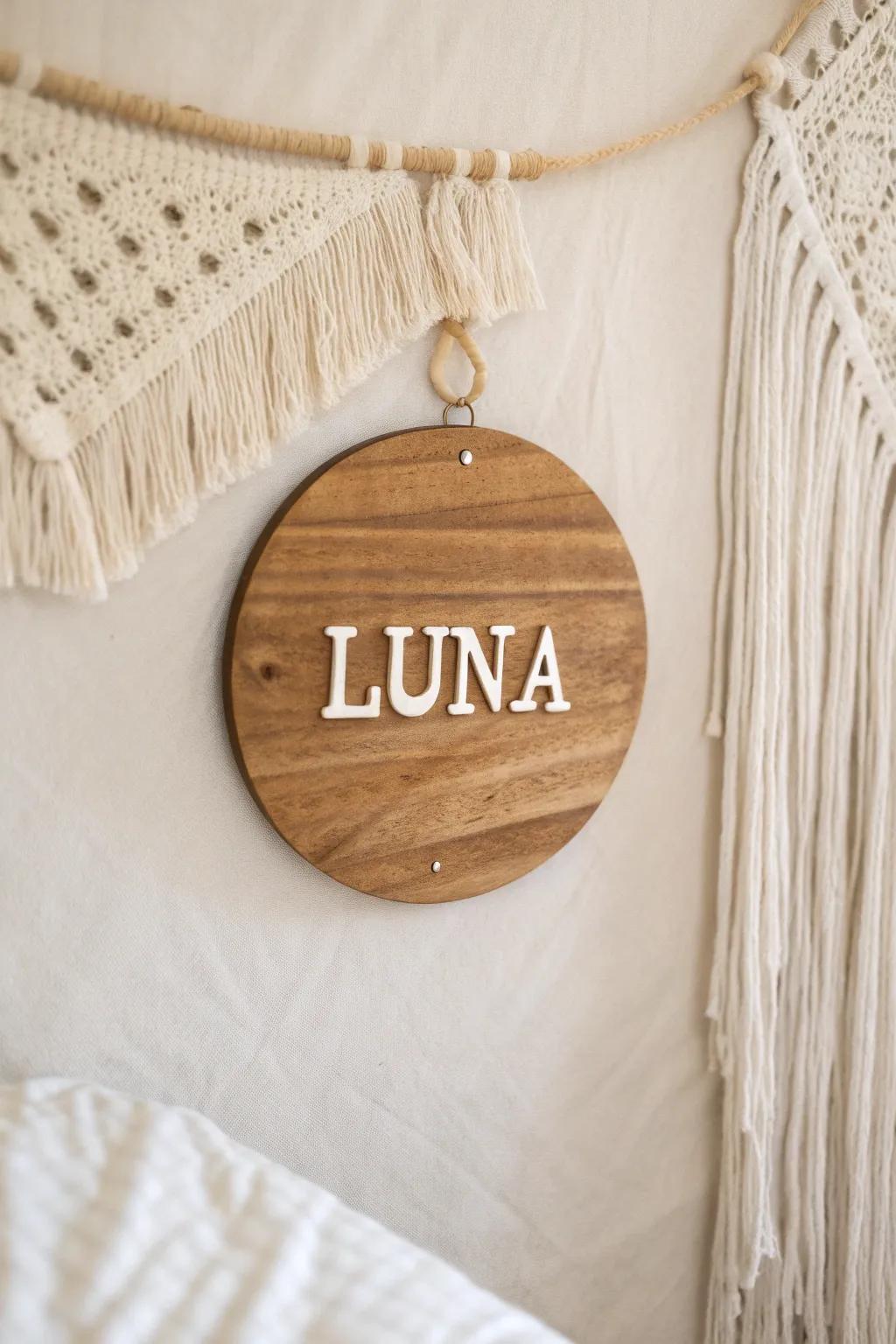 A reclaimed wood nursery name sign—minimal, warm grain, and heirloom-worthy charm.