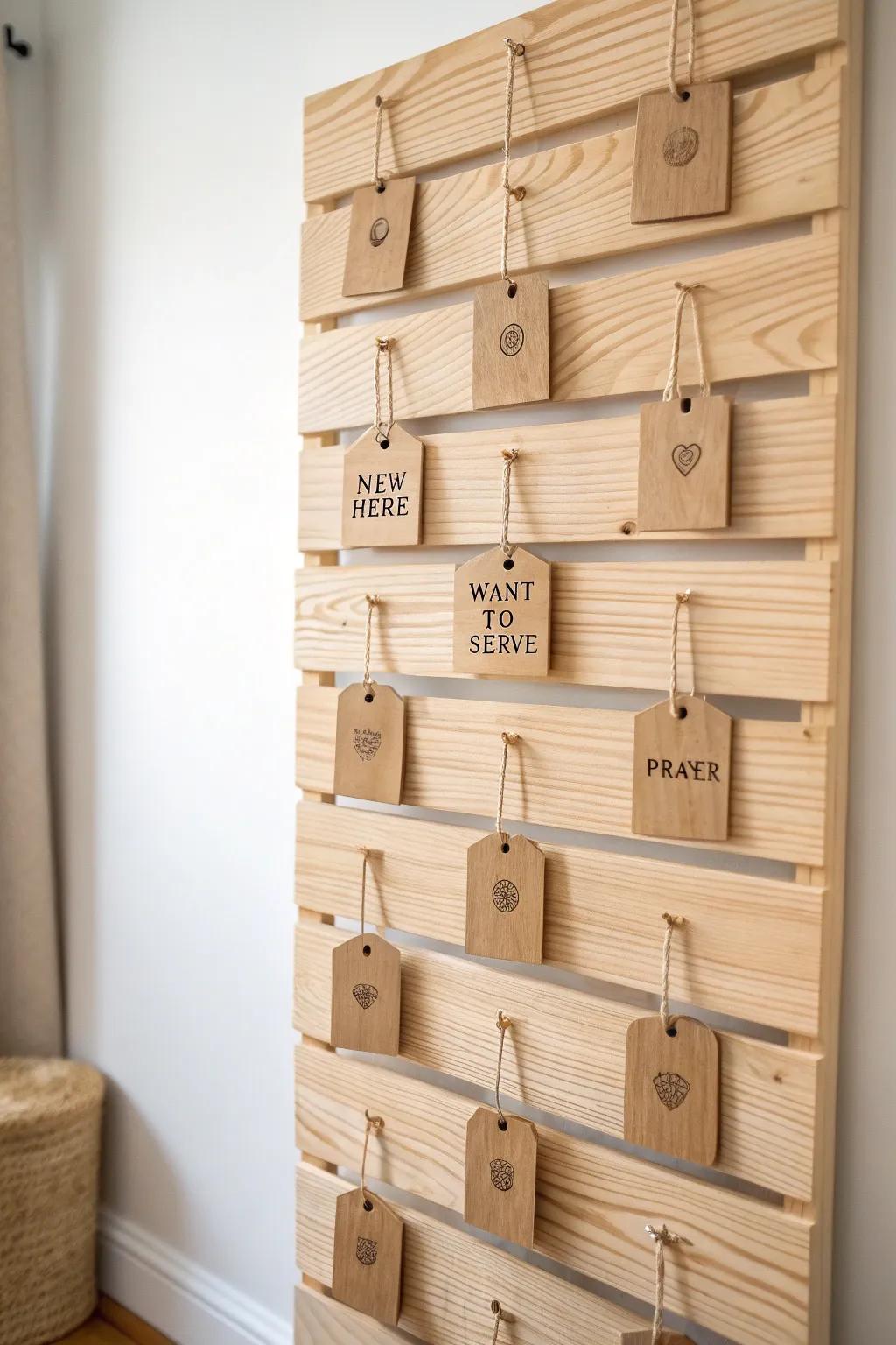A handcrafted wood tag wall backdrop that invites guests to grab a tag and start a warm chat.