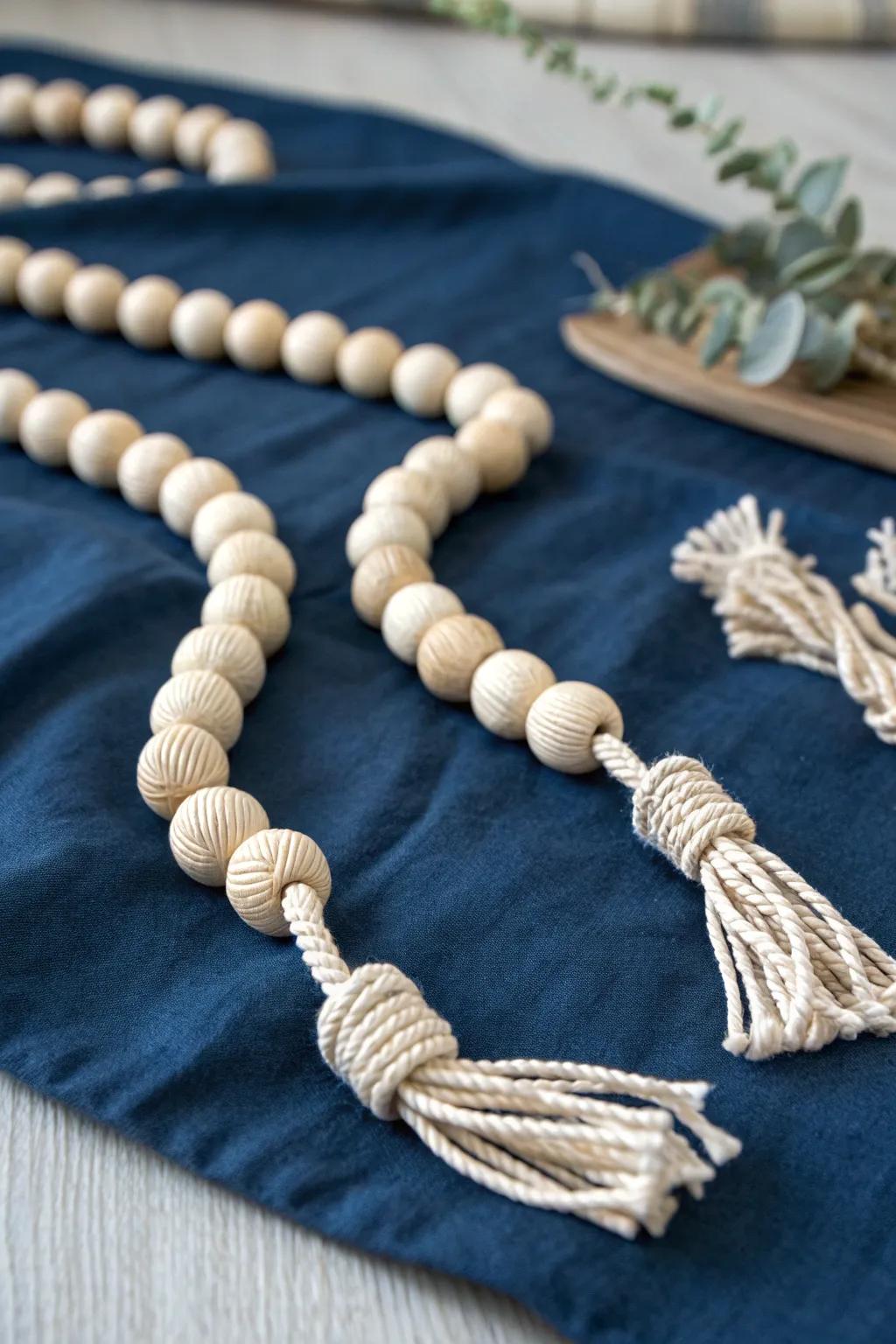 Minimal coastal charm: a wood bead garland finished with nautical knots for effortless styling.