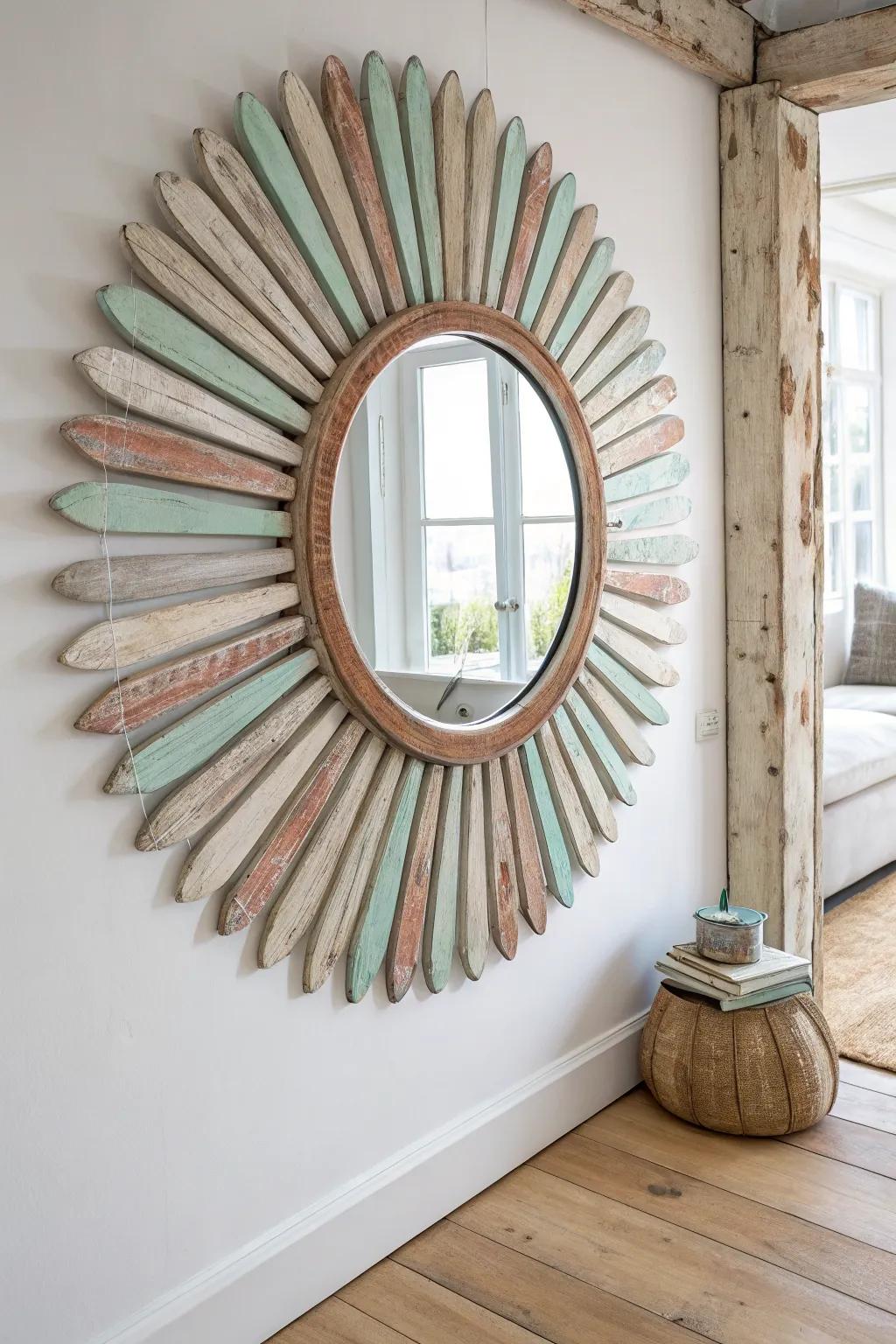 Sunburst mirror framed with fanned vintage oar blades—aged wood and soft paint tones.