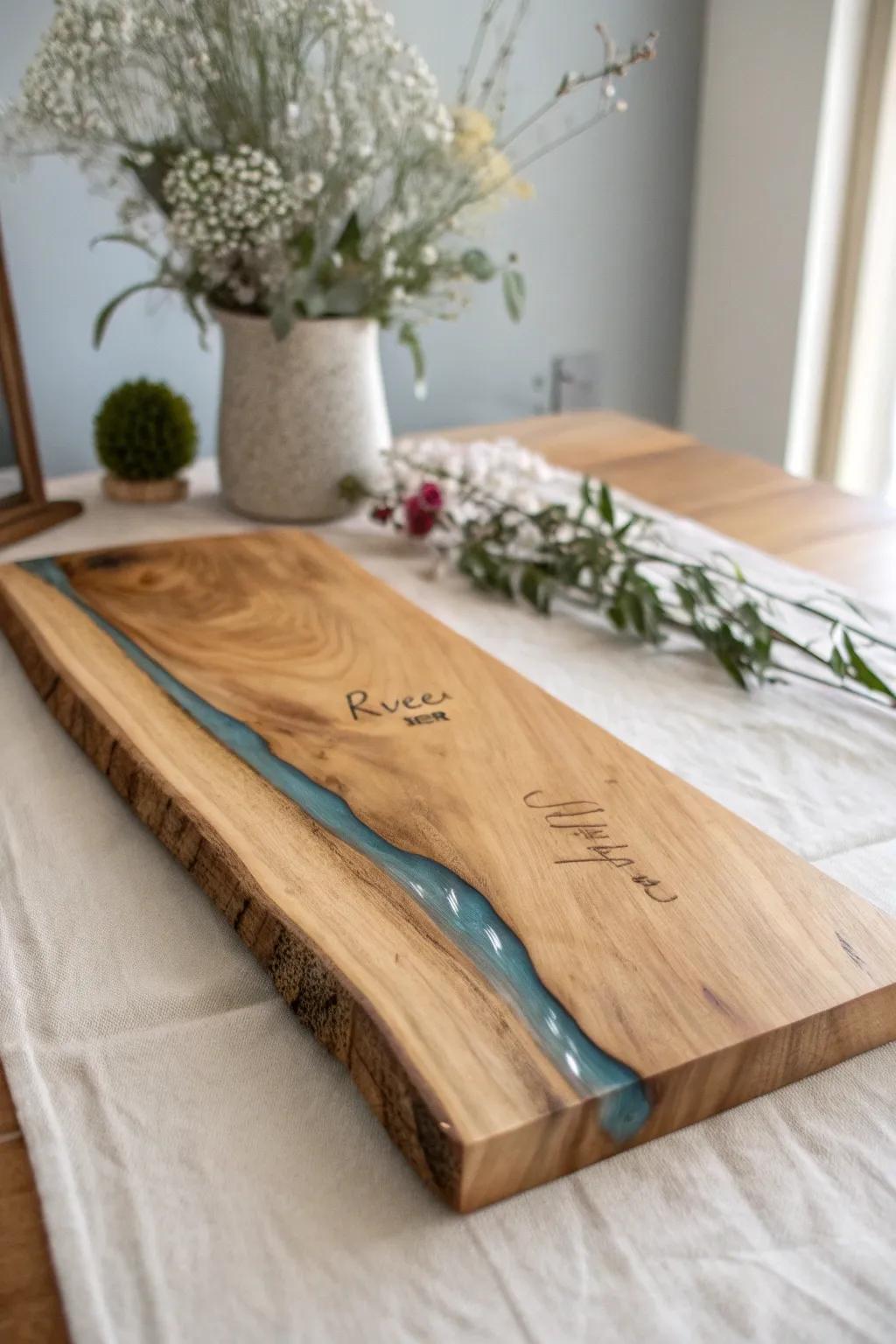 Epoxy river guestbook plank: live-edge warmth meets modern resin—keepsake wall art for weddings.