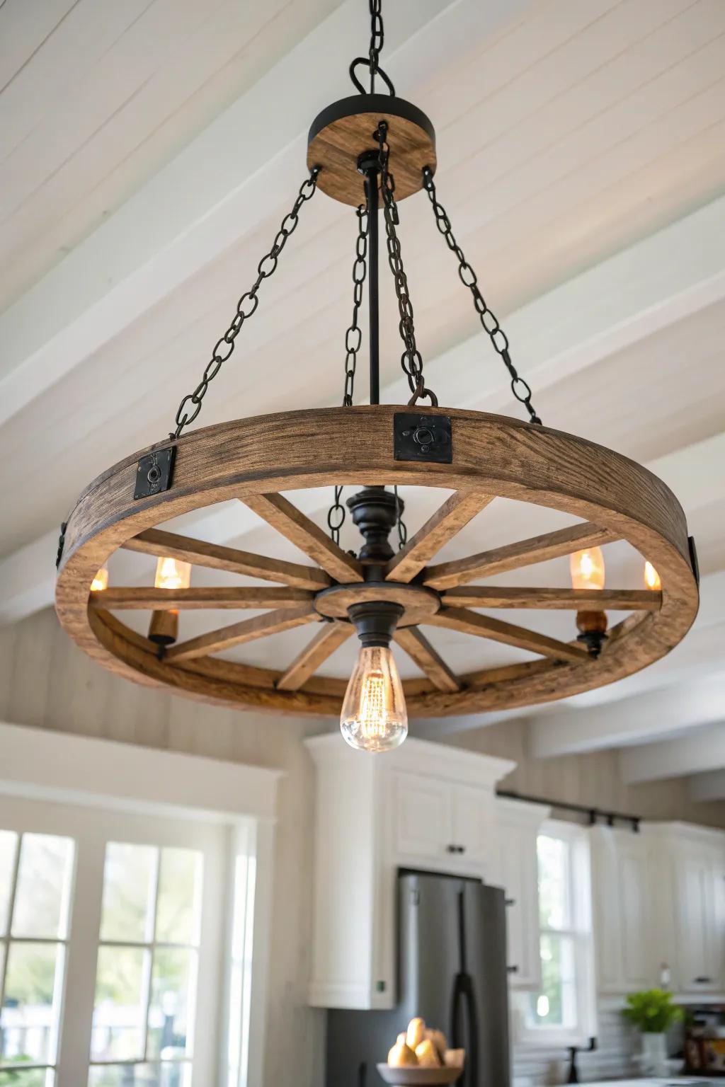 A wagon wheel chandelier adds rustic drama and warmth to tall, airy kitchens.