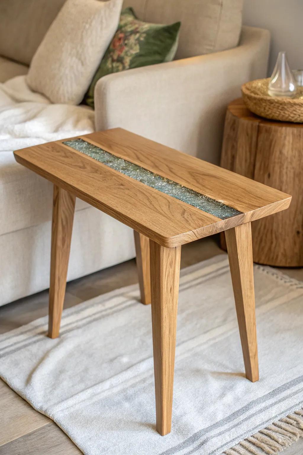 A sleek oak sofa side table with a shimmering resin “river” inlay—minimal, warm, and modern.