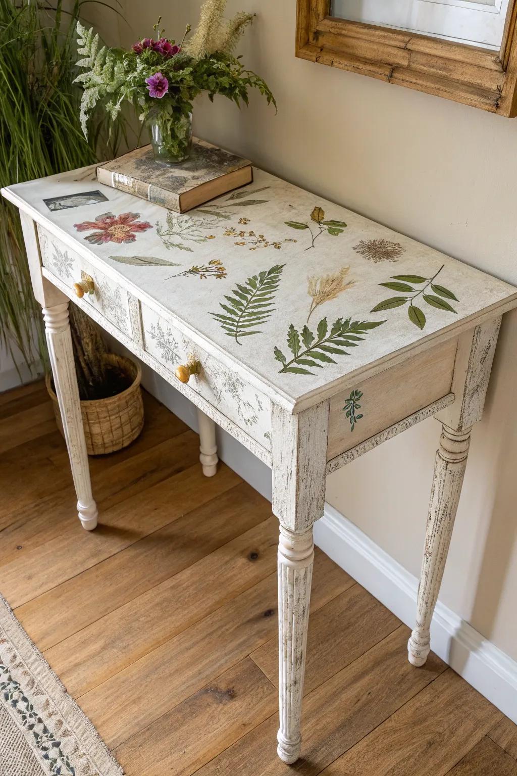 Pressed botanicals under a matte seal transform a distressed entryway table into shabby chic art.