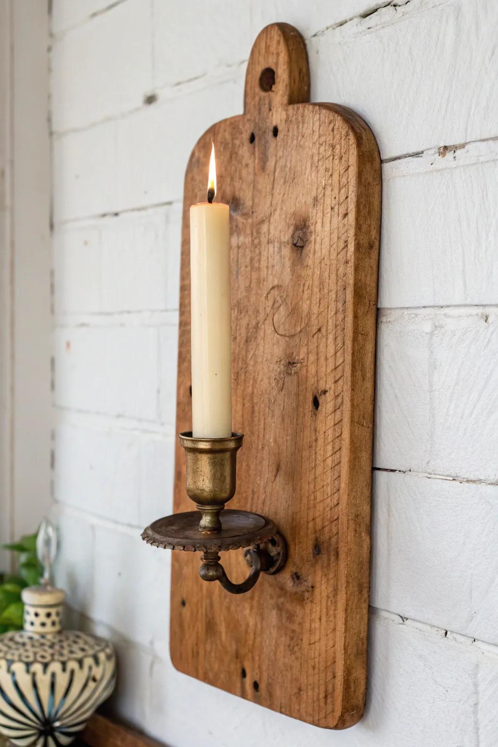 Antique breadboard wall sconce—warm patina, knife marks, and brass for bold minimal charm.