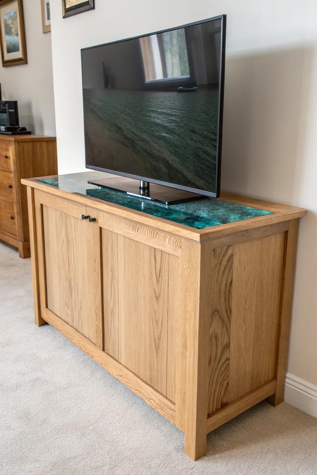Sleek TV lift cabinet with a glossy teal resin inlay—minimal, bold, and artisan-made.