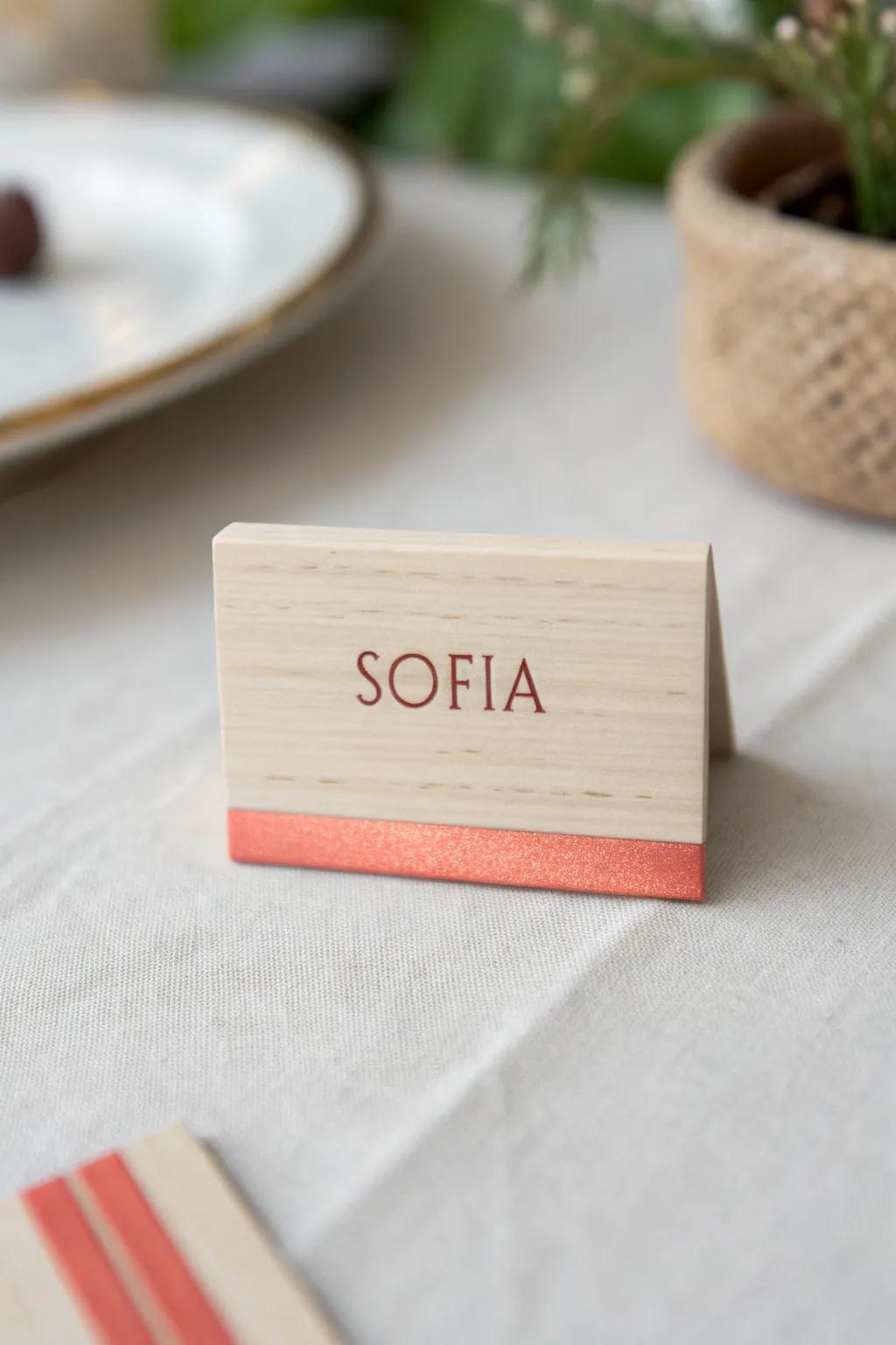 A keepsake place card: warm wood grain with a bold resin inlay line, made to take home.
