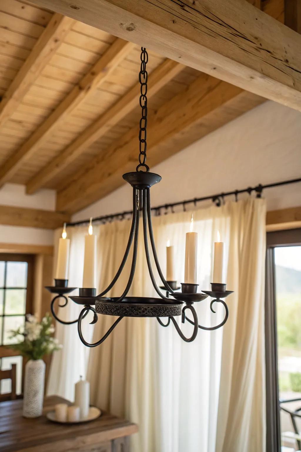 Matte black iron candle chandelier—minimal cottage charm with warm wood contrast.