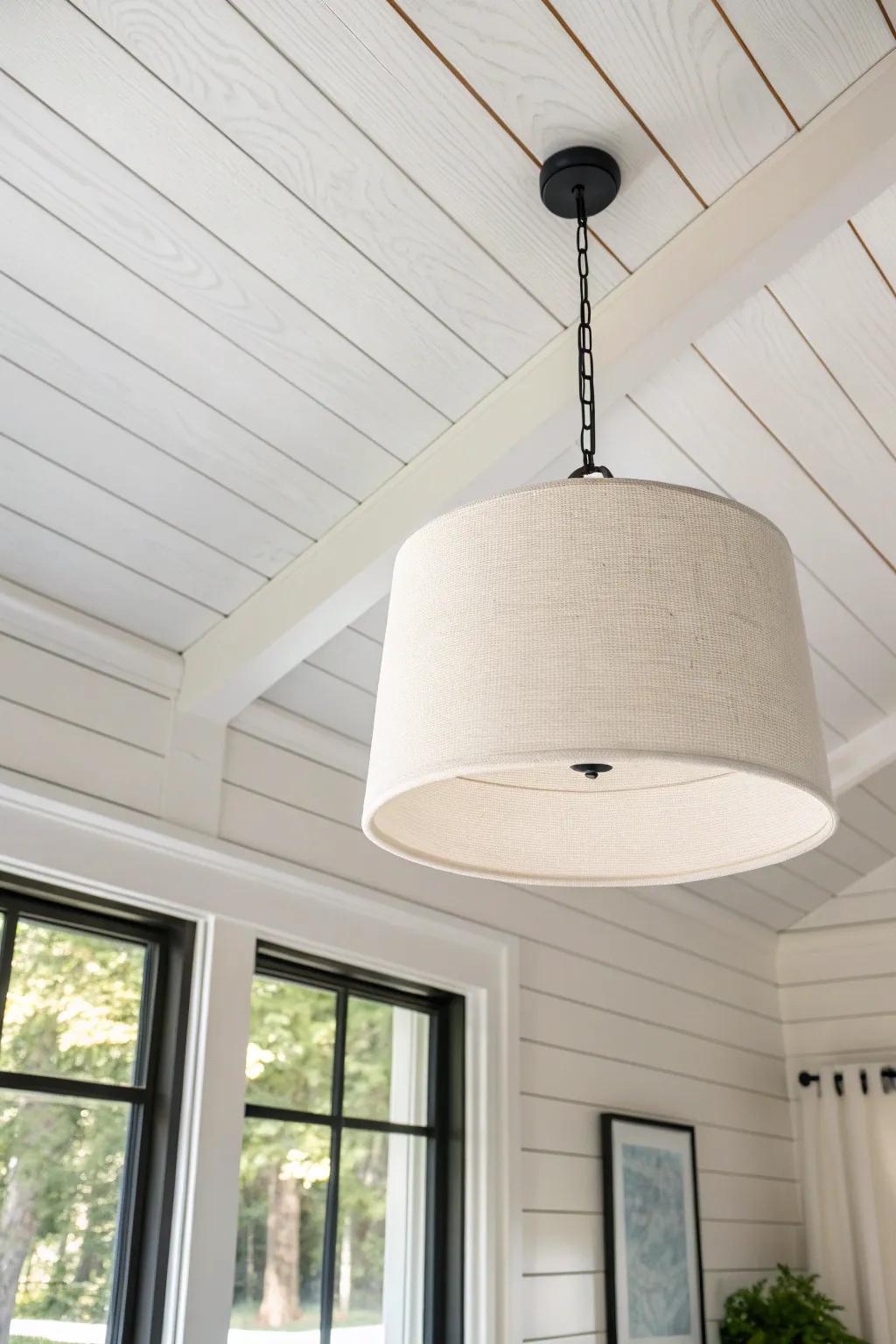 White shiplap ceiling + a simple pendant: bright, textured, and effortlessly cozy.