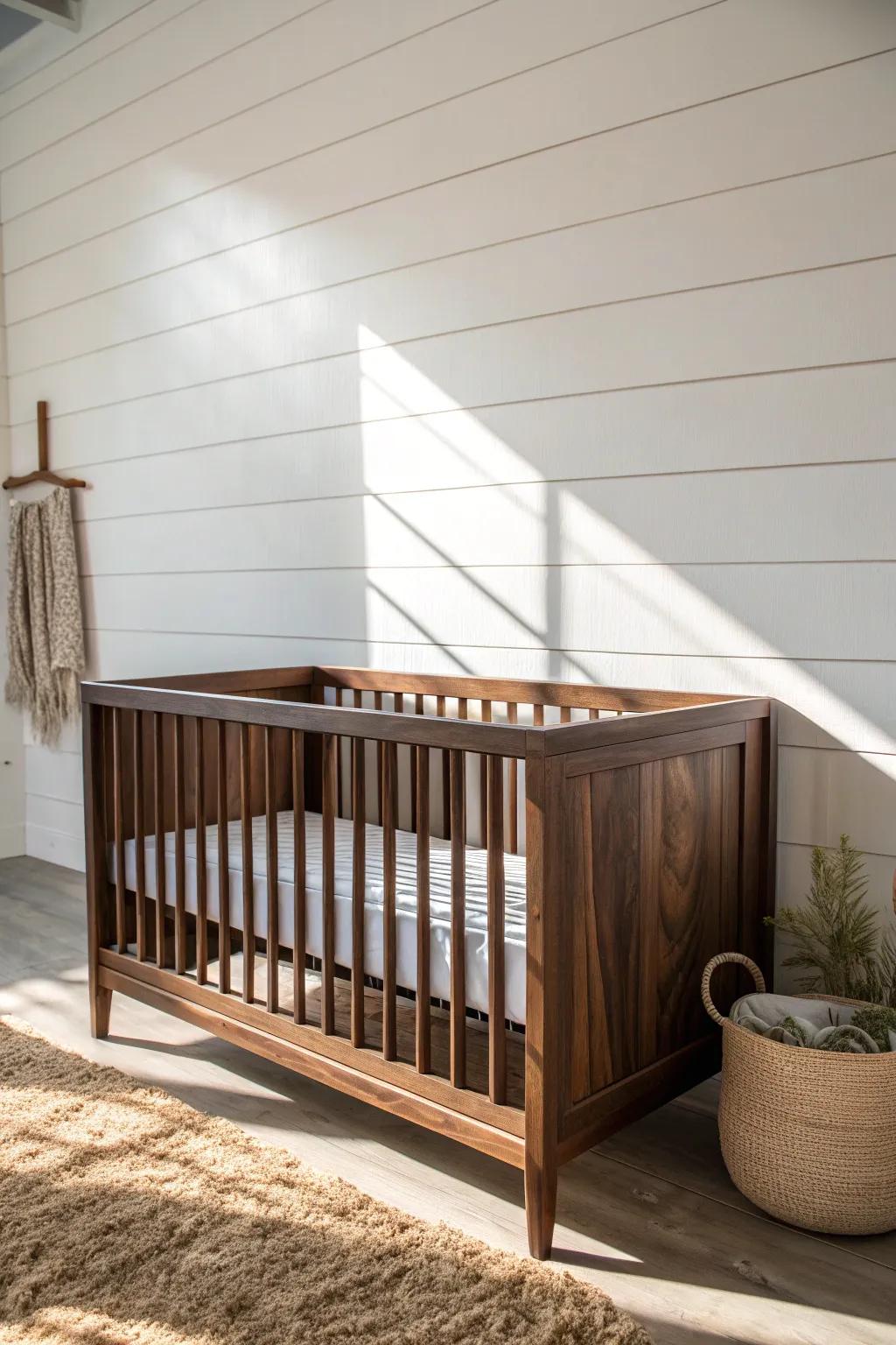 White shiplap + a dark wood crib: clean, airy contrast with rustic boy-nursery warmth.