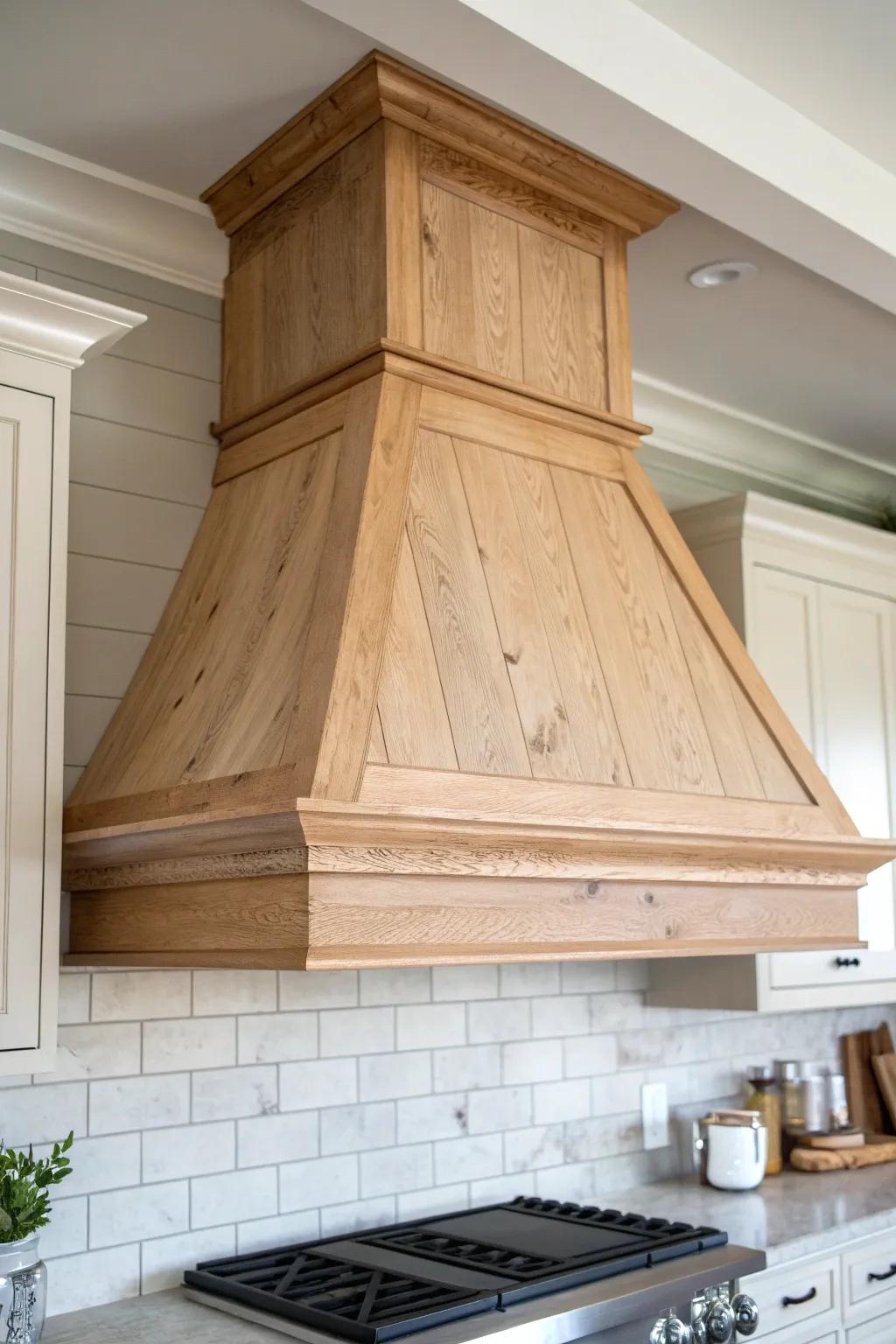 A tapered farmhouse wood hood that brings rustic warmth with clean Scandinavian simplicity.