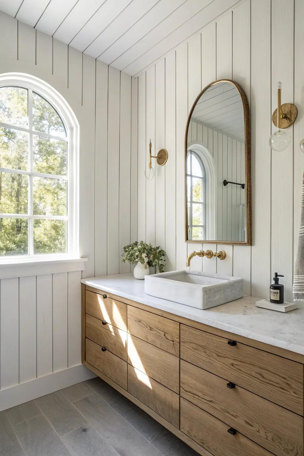 Floor-to-ceiling vertical shiplap behind the vanity for a crisp, crafted spa-like focal point.