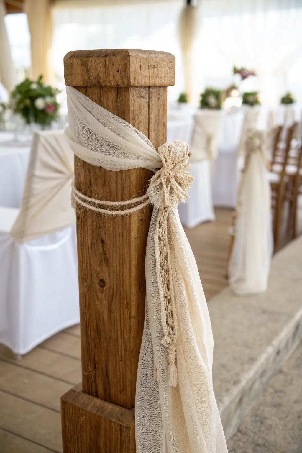 Airy linen swags on a light-oak pillar—romantic, minimal, and perfectly secured for breezy vows.